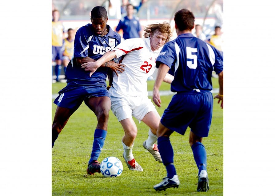 IU sophomore Jacob Peterson shields the ball from two University of California at Santa Barbara players during the 2004 NCAA College Cup Final at the StubHub Center, then known as the Home Depot Center, in Carson, California. The Hoosiers defeated UCSB in penalty kicks to win the program's seventh national title.