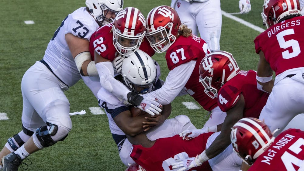 Then-senior defensive lineman Michael Ziemba and then-junior defensive back Jamar Johnson tackle Penn State then-freshman running back Keyvone Lee on Oct. 24, 2020, in Memorial Stadium.﻿ Indiana will face off against Penn State on Saturday in State College, Pennslyvania.