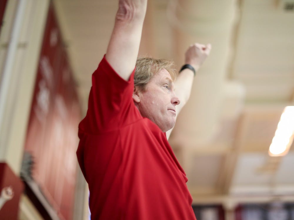 IU swimming head coach Ray Looze raises his arms during the Big Ten Tournament meet Feb. 20, 2019 at Counsilman-Billingsley Aquatic Center in Bloomington. Looze and IU head diving coach Drew Johansen will join Team USA’s coaching staff for the 2020 Olympic Games.