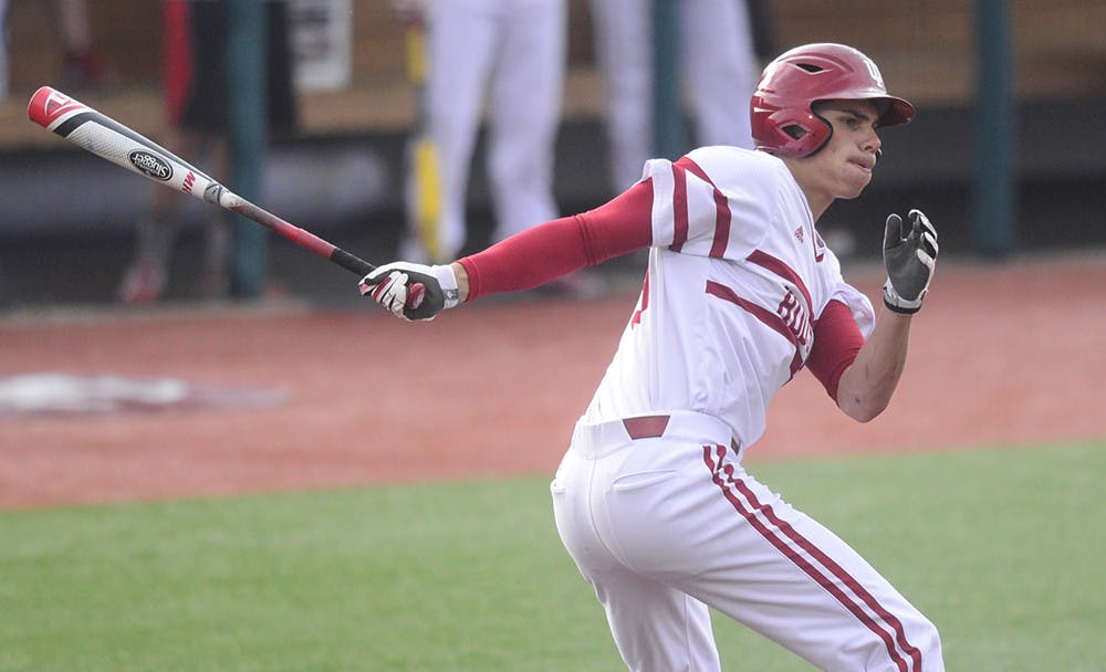 Sophomore Craig Dedelow hits a triple to lead off IU's game against Cincinnati on Wednesday at Bart Kaufman Field.