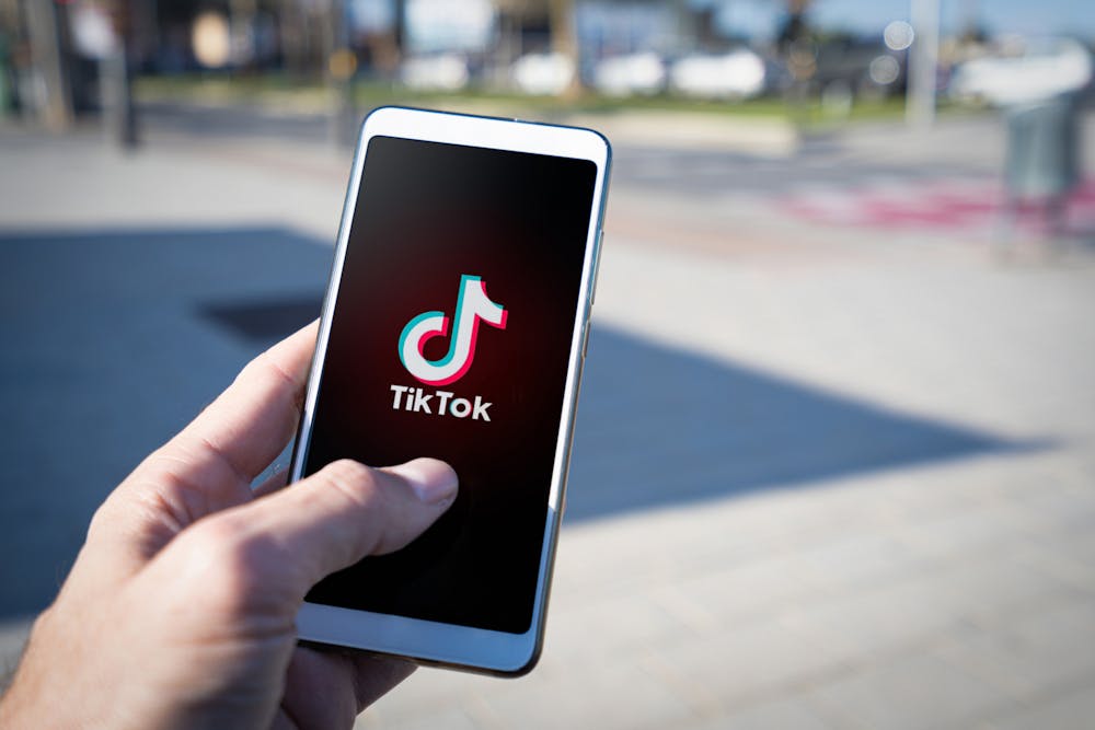 <p>The TikTok logo is displayed on a student&#x27;s phone ﻿on April 19, 2023. An IU student is receiving criticism for posting a TikTok video many have deemed racist against a Palestinian student.</p>