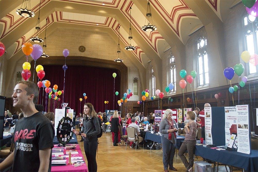 Students mill around Alumni Hall getting information during the Health Fair on Tuesday. At the fair, students learned about on-campus services available to help maintain health.