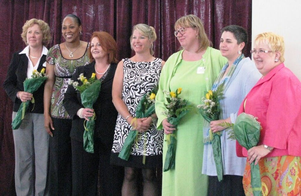 A group of felades business leaders stand after receiving the Women Excel Bloomington award in 2015. The Women Excel Bloomington was started by the Bloomington Chamber of Commerce in 2010 to motivate women leaders in business and the community. 