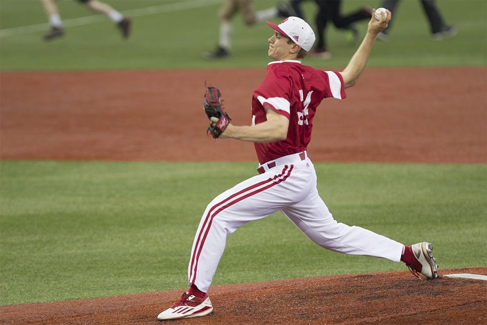 Freshman pitcher Jonathan Stiever throws a pitch during IU's cancelled game against Evansville on Wednesday at Bart Kaufman Field. 