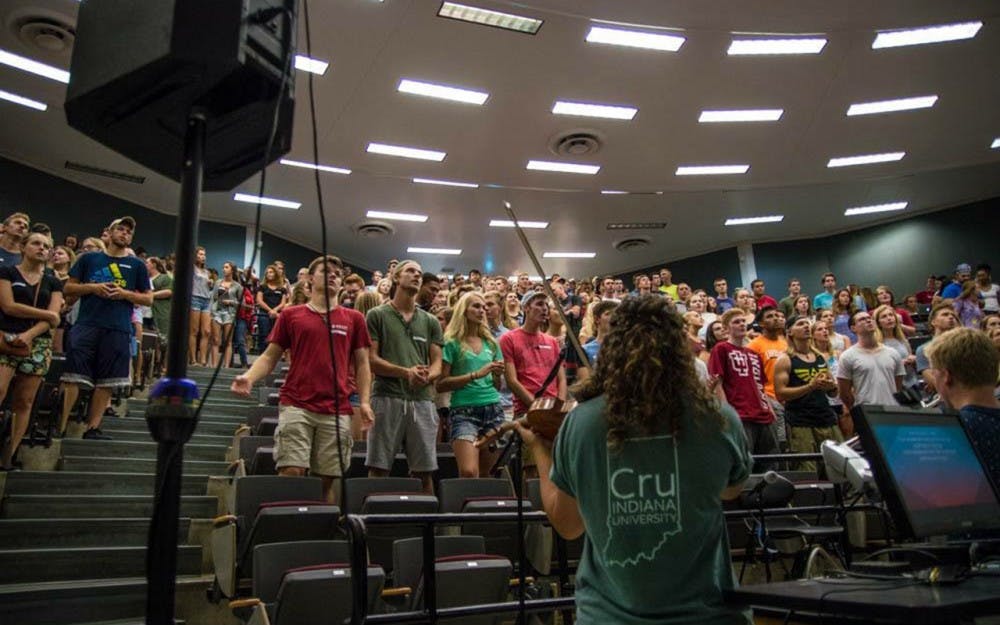Christian campus group Cru holds a weekly meeting that attracts 200 to 300 students. The members gather not only to worship, but to talk about issues relevant to college life. 
