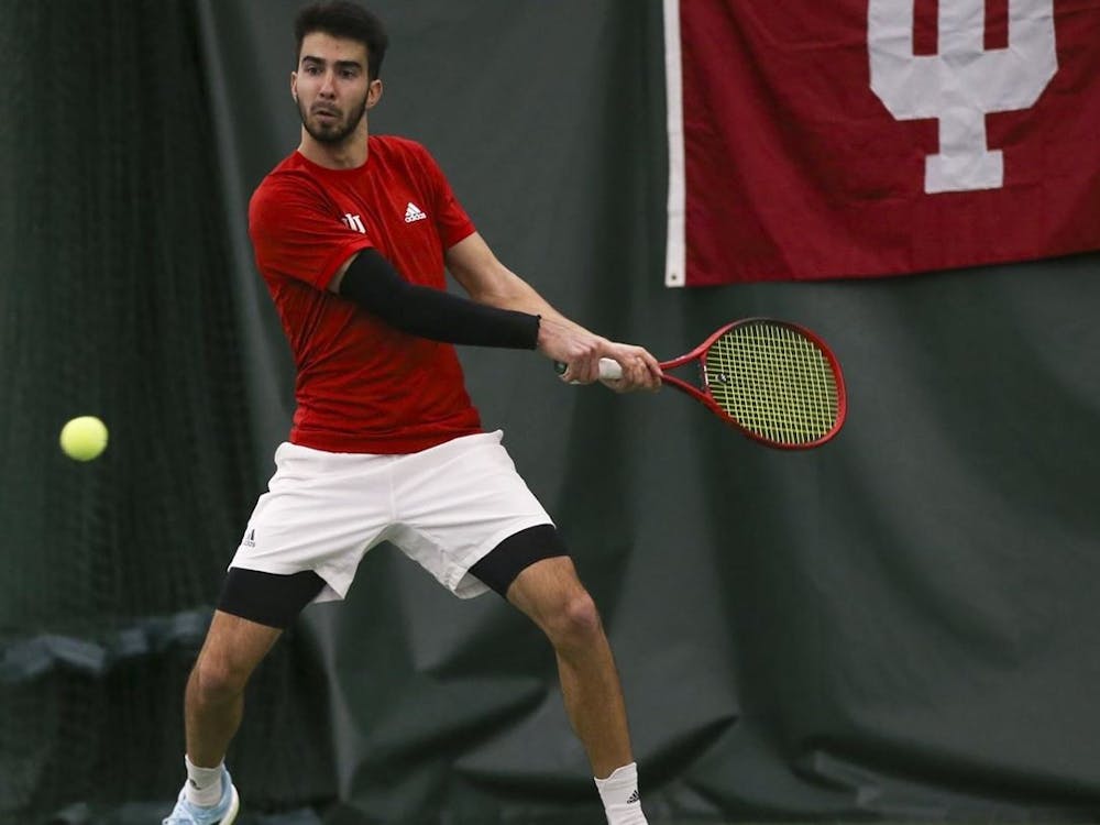 Then-sophomore Luka Vukovic prepares to hit the ball during a match against Wisconsin on March 26, 2021. Indiana lost to in-state rival Purdue 4-0 on Saturday at the IU Tennis Center.