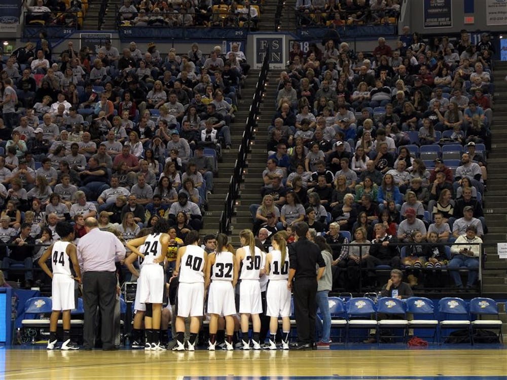 The Western High School Panthers huddle up during a timeout in the IHSAA 3A girls basketball state finals. Western would win against two-time champions Evansville Mater Dei, 38-35.