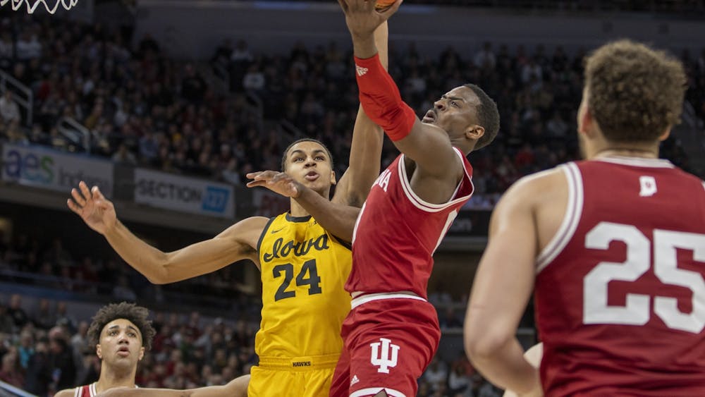 Then-senior guard Xavier Johnson goes for a layup against Iowa on March 12, 2022, at Gainbridge Fieldhouse. Johnson and Indiana men&#x27;s basketball went 4-0 over Thanksgiving break.