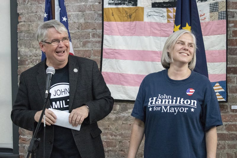 Mayor John Hamilton and his wife Dawn Johnsen smile May 7, 2019, at the Dimension Mill. Johnsen tested positive for COVID-19 on Thursday, according to a press release from the City of Bloomington.