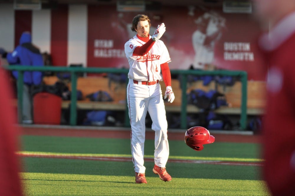 Sophomore Tony Butler tosses his helmet towards the dugout after grounding out to end IU’s first home game. The Hoosiers lost to Middle Tennessee State 5-3.