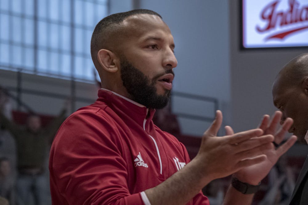 <p>IU wrestling coach Angel Escobedo cheers on IU on Feb. 2 at Wilkinson Hall. Two members of the 2020 IU wrestling recruiting class have been named to Wrestling USA Magazine&#x27;s All-American team.</p>