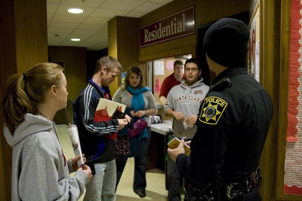 IUPD Officer Ben Rupenthal talks with Eigenmann RA's Katie Rogers, Daniel Roahrig and Anton Zanotto before being escorted to a students dorm room for an incident follow up February 5, 2009 at Eigenmann Dormitory.