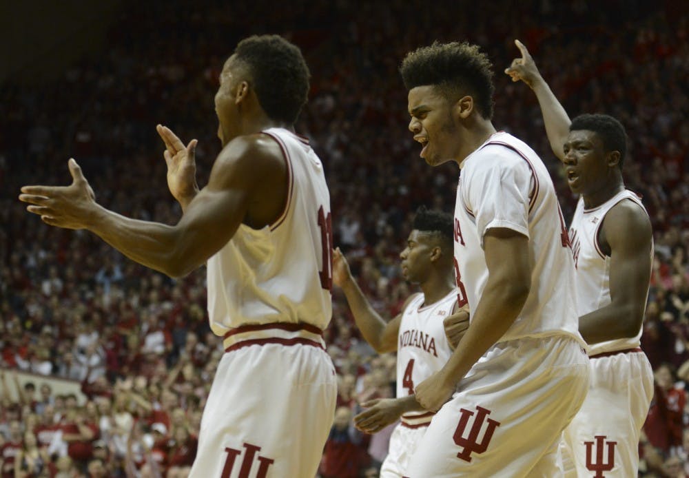 Senior guard Yogi Ferrell, freshman foward Juwan Morgan and freshman center Thomas Bryant celebrate during the game against Purdue on Saturday at Assembly Hall. The Hoosiers won 77-73.