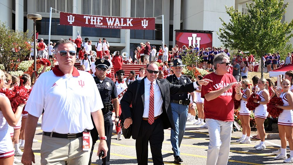 Coach Tom Allen and Athletics Director Fred Glass walk down "The Walk" prior to the Indiana football game on Sept. 23, 2017. IU will open up home play on Saturday against Virginia.