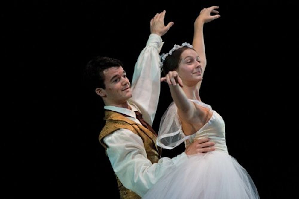 Freshman Paul Dandridge and sophomore Heidi Satterthwait dance Tuesday evening during the dress rehearsal for “Les Sylphides.” The fall ballet, “Perspectives 1900s” opened Friday evening at the MAC and featured contemporary and traditional styles of dance.