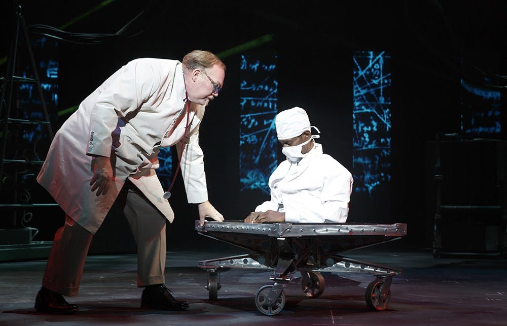 Kevin James, The Inventor, goes through one of his magic tricks in a performance on Tuesday night in IU Auditorium. James is one of seven magicians that performed as pat of The Illusionists. 