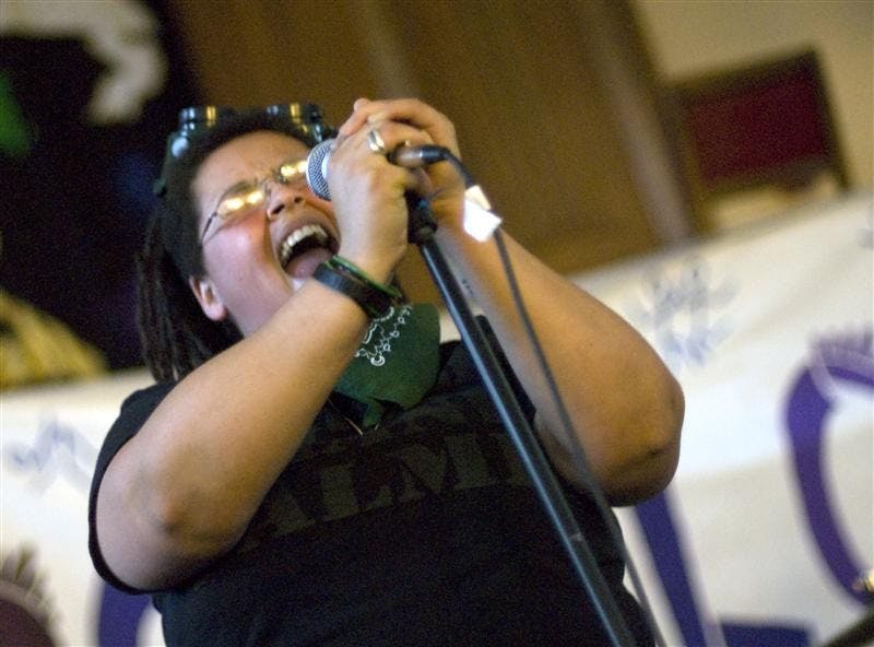 Jada B, the lead singer for all female band The Ladyquakes!, performs at Lesbopalooza Saturday afternoon at Collins LLC. The Out-sponsored event celebrating women featured drag performances, several bands, an art gallery, poetry readings, a Stich N' Bitch knitting session, and a discussion on sexual health.