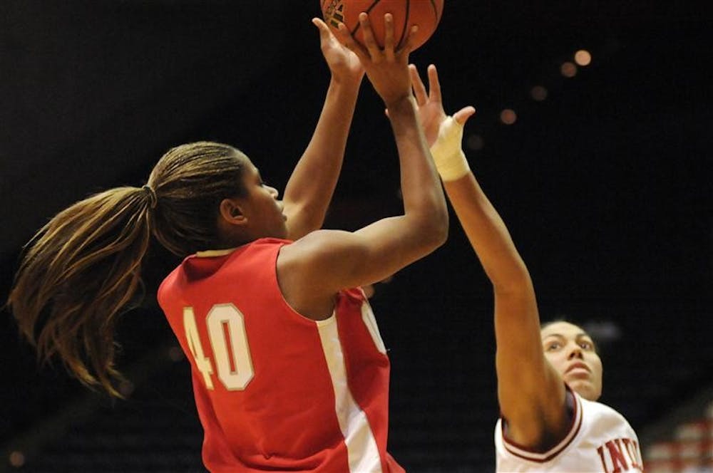 Ohio State guard Brittany Johnson shoots over IU forward Whitney Thomas during the second half of a game Sunday in Bloomington. No. 20 Ohio State won 79-67.