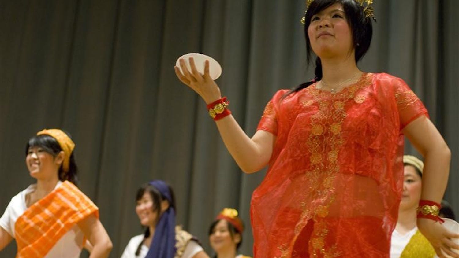 Members of the Indonesian Student Association perform a traditional dance at the IU World's Fare on Thursday night in the IMU Alumni Hall. The World's Fare included several performances and a variety of stations with free food prepared by different student organizations.