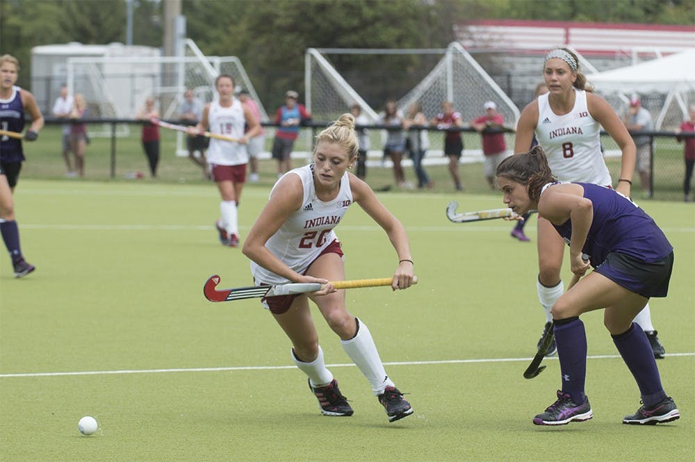 Sophomore Maddie Latino moves to evade a Northwestern defender on Sunday at the IU Field Hockey Complex. Latino was named Big Ten co-offensive player of the week for her performance in IU's victories over #16 Iowa and #14 Northwestern.