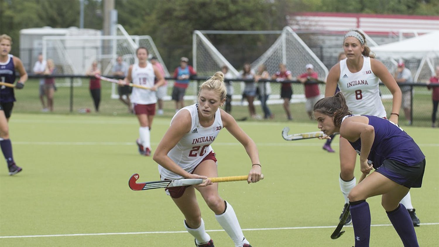 Sophomore Maddie Latino moves to evade a Northwestern defender on Sunday at the IU Field Hockey Complex. Latino was named Big Ten co-offensive player of the week for her performance in IU's victories over #16 Iowa and #14 Northwestern.
