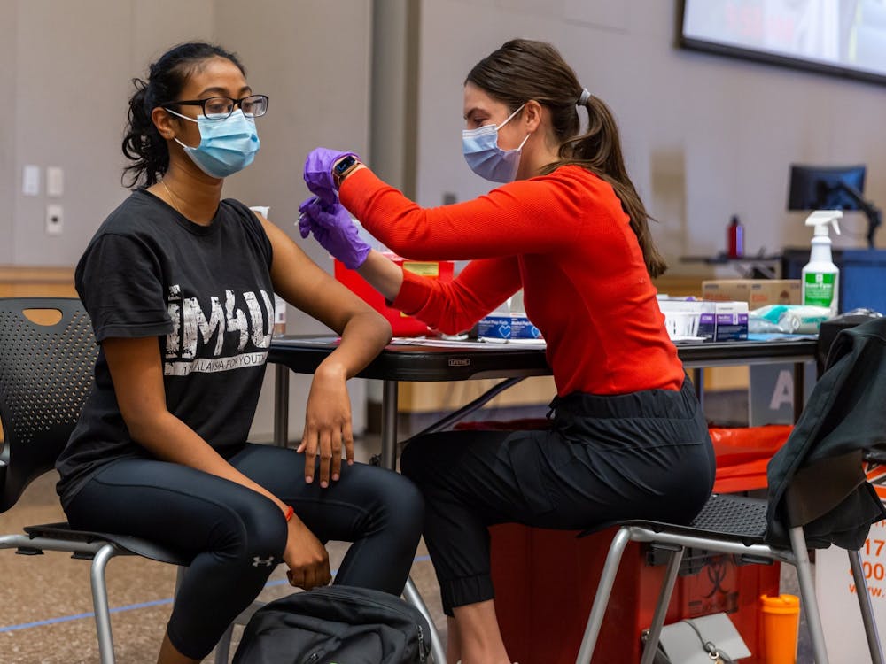 A COVID-19 vaccine is administered to a patient April 6, 2021, at the IUPUI Campus Center clinic. President Joe Biden announced new vaccine mandates Thursday, affecting 100 million Americans.