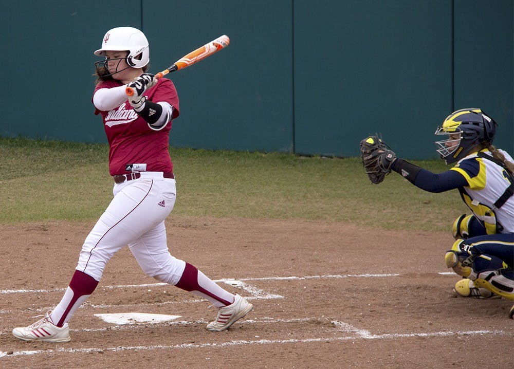 Senior Michelle Huber swings at a pitch on Saturday afternoon in a 0-8 lost against #2 University of Michigan at Andy Mohr Field Apr. 16 2016.