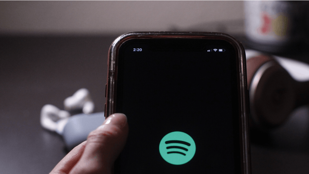 A person opens the Spotify app on a phone Dec. 5, 2021.