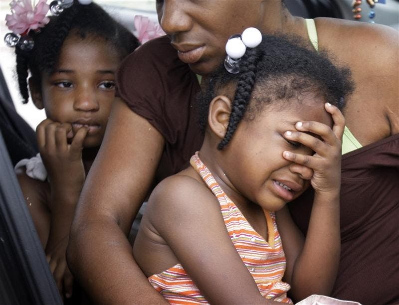 Debra Peterson comforts her granddaughters as they wait in their car to return to New Orleans Tuesday in Slidell, La.  Peterson and her grandchildren evacuated New Orleans to escape Hurricane Gustav.