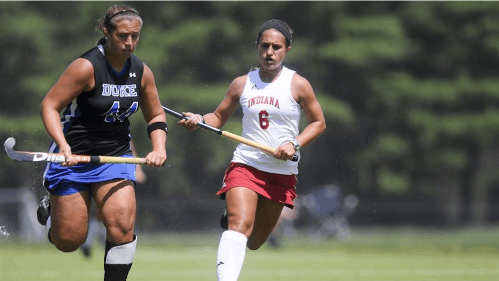 Freshman forward Nicole Volgraf pursues Duke's Brenna Rescigno in order to gain possesion of the ball during the Hoosier's 3-2 overtime win against the Blue Devils on Sunday at the IU Field Hockey Complex. 