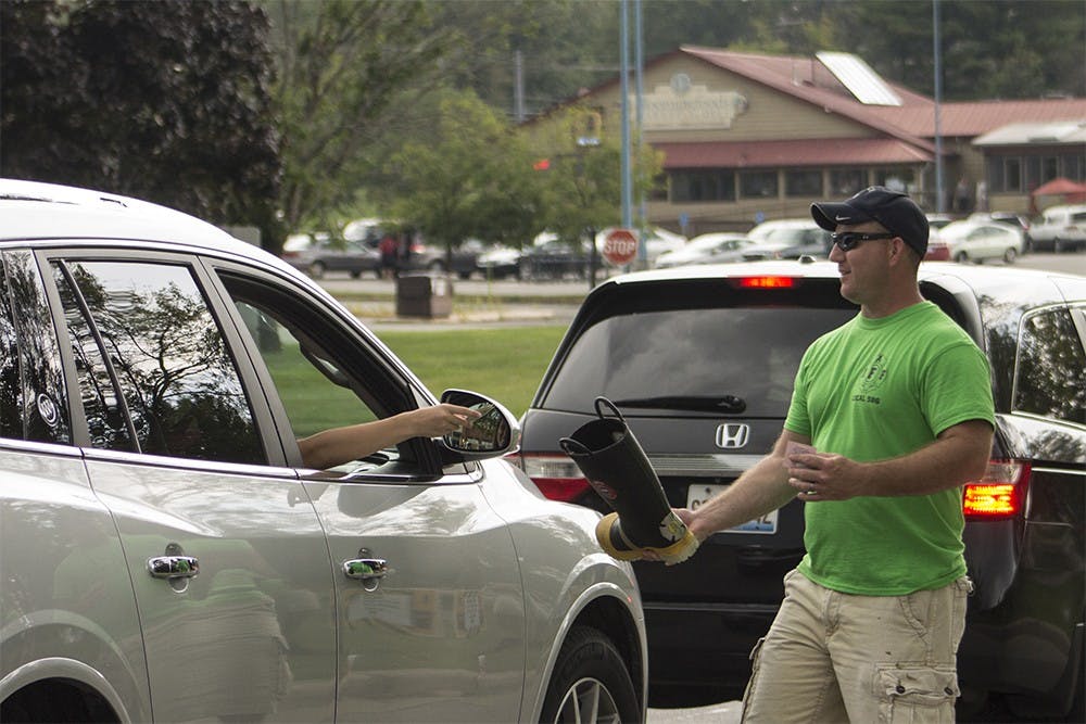 Danny Gillespie, a nine-year member of the Bloomington Fire Department, collects money for the department's annual Fill the Boot Fundraiser at College Mall on Monday. Funds raised in previous years have gone towards the Muscular Dystrophy Association's efforts to find treatments and cures for muscular diseases 