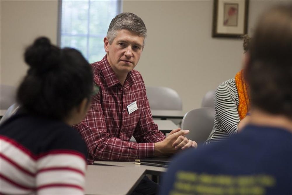 Brian Ellison, a candidate running for the Monroe County Council position, listens to a student's question on Thursday at the local candidate's forum. The forum took place at the Hutton Honors College.