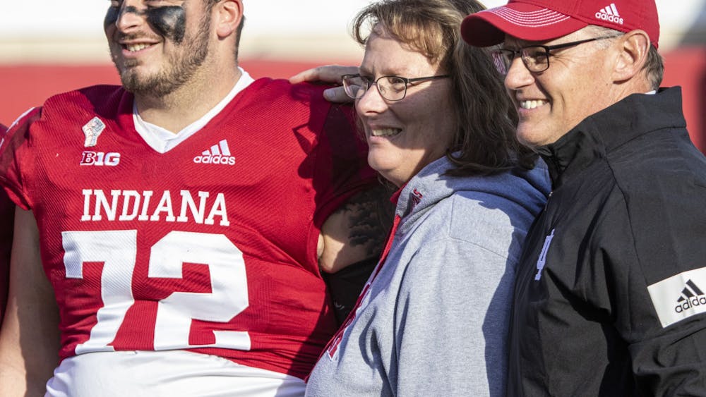Graduate offensive lineman Dylan Powell smiles with head coach Tom Allen prior to the game against Minnesota on Nov. 20, 2021, at Memorial Stadium. Indiana held ceremony honoring graduating seniors and graduate students prior to the game against Minnesota.