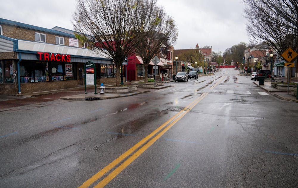 <p>A near-empty Kirkwood Avenue is pictured. IU experts said COVID-19 has been difficult on the economy and predict that it will be especially hard on small businesses and the hospitality industry.</p>