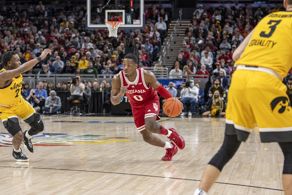 <p>Then-senior guard Xavier Johnson drives to the basket against Iowa in the Big Ten Tournament semifinal on March 12, 2022, at Gainbridge Fieldhouse. Amid his first season with Indiana men’s basketball after transferring from the University of Pittsburgh, the senior guard had to get comfortable with the Big Ten crowds.</p>
