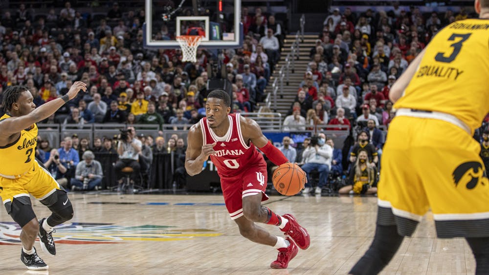 Then-senior guard Xavier Johnson drives to the basket against Iowa in the Big Ten Tournament semifinal on March 12, 2022, at Gainbridge Fieldhouse. Amid his first season with Indiana men’s basketball after transferring from the University of Pittsburgh, the senior guard had to get comfortable with the Big Ten crowds.