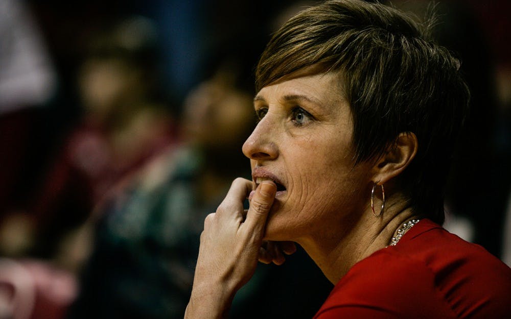 Head coach Teri Moren takes a knee at the edge of the court during the fourth quarter of play. The Hoosiers held on late to beat the Iowa Hawkeyes 79-74 Thursday, Feb. 4. 