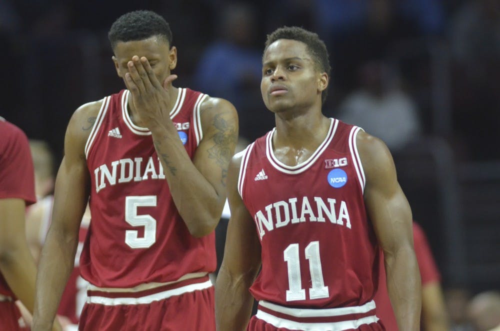  Senior guard Yogi Ferrell and junior guard Troy Williams walk back to the court after a timeout during the second half of the Sweet Sixteen game against number one seed North Carolina on . The Hoosiers lost 101-86.
