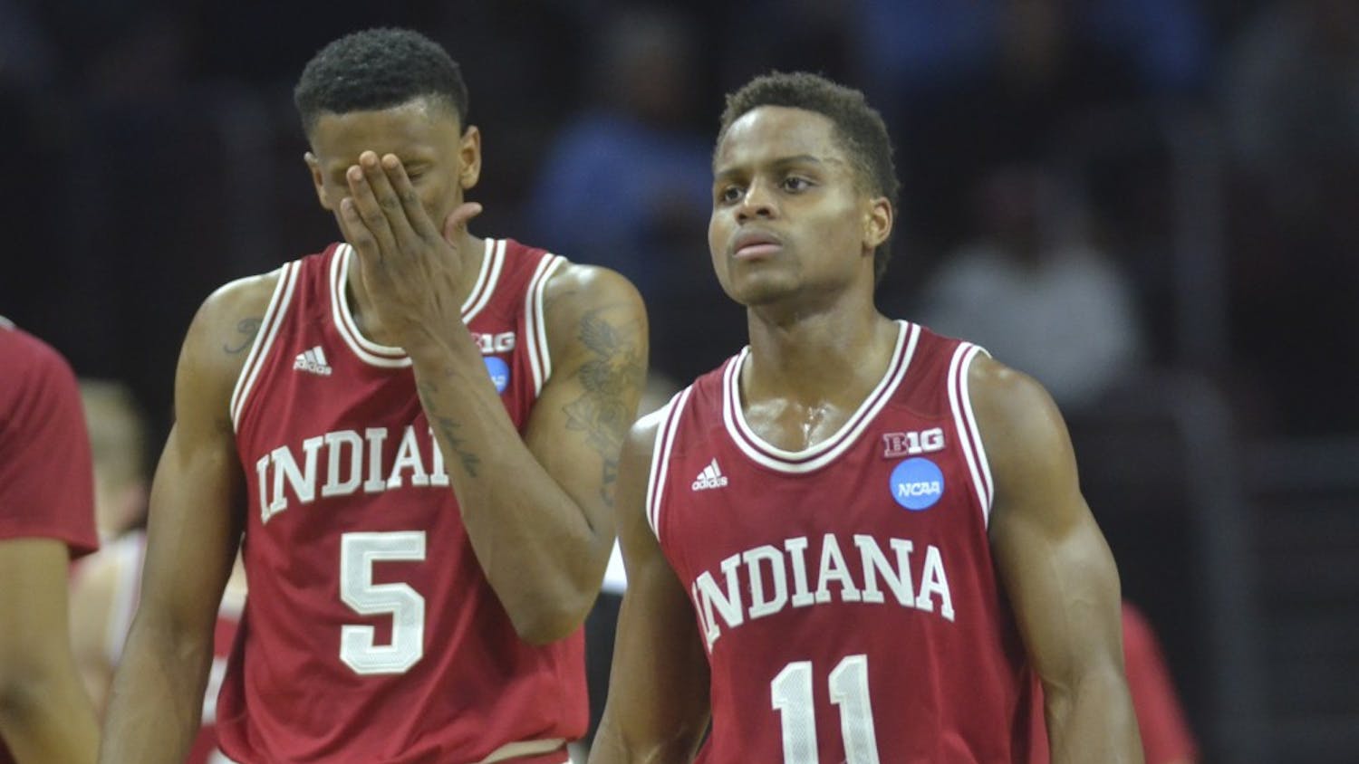 Senior guard Yogi Ferrell and junior guard Troy Williams walk back to the court after a timeout during the second half of the Sweet Sixteen game against number one seed North Carolina on . The Hoosiers lost 101-86.