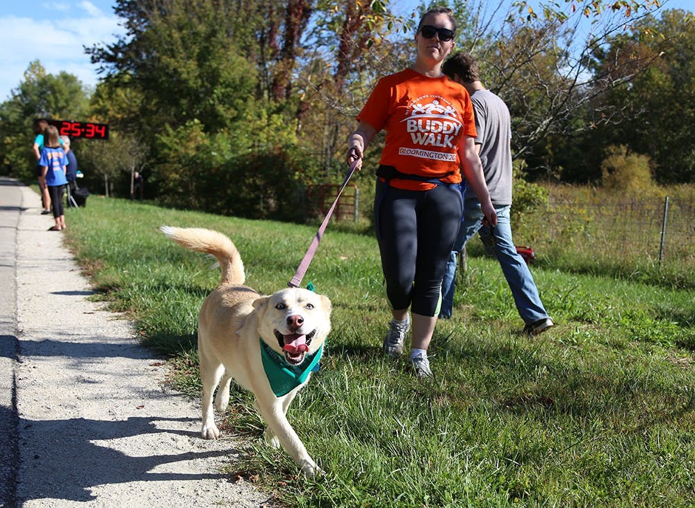 Rachel Melnick and her dog, Lana, finish the Run for the Animals on the B-Line trail on Satuday morning to raise money for the Monroe County Humane Association. 