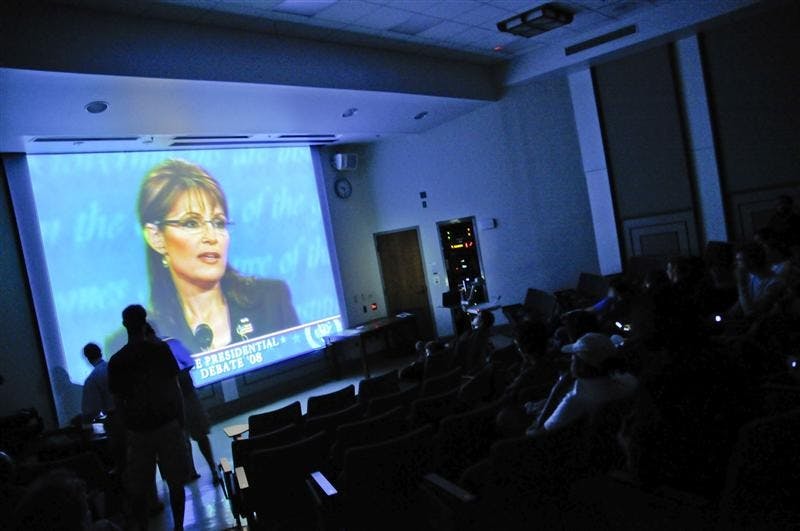 People watch as Republican vice presidential candidate Sarah Palin debates Joe Biden during a watching party on Thursday night in Woodburn Hall. The party was sponsored by the Student Alliance for National Security.