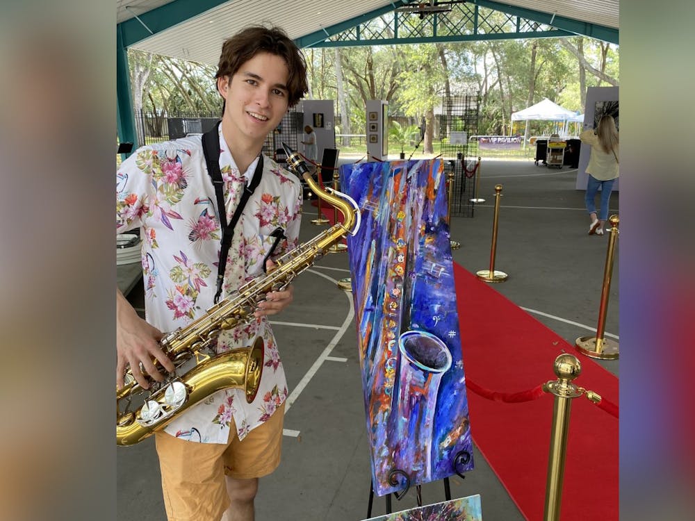 Saxophonist Solomon Keim smiles for a picture during the Uptown Music Festival. Keim is scheduled to perform at 4:30 p.m. on June 2 in People&#x27;s Park as part of the outdoor concert series. 