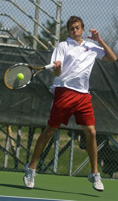 Freshman Stephen Vogl returns the ball April 12 at the Varsity Tennis Courts. The Hoosiers leave Thursday for the Big Ten Tournament in Ann Arbor, Mich.