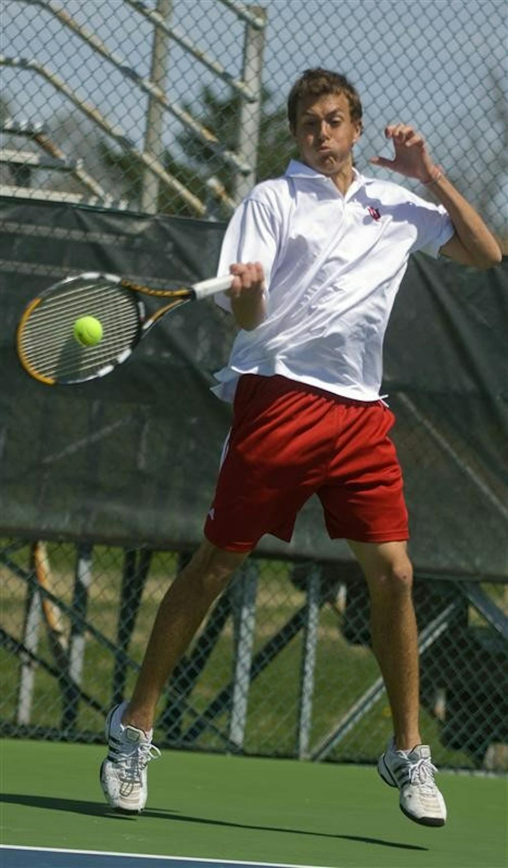 Freshman Stephen Vogl returns the ball April 12 at the Varsity Tennis Courts. The Hoosiers leave Thursday for the Big Ten Tournament in Ann Arbor, Mich.