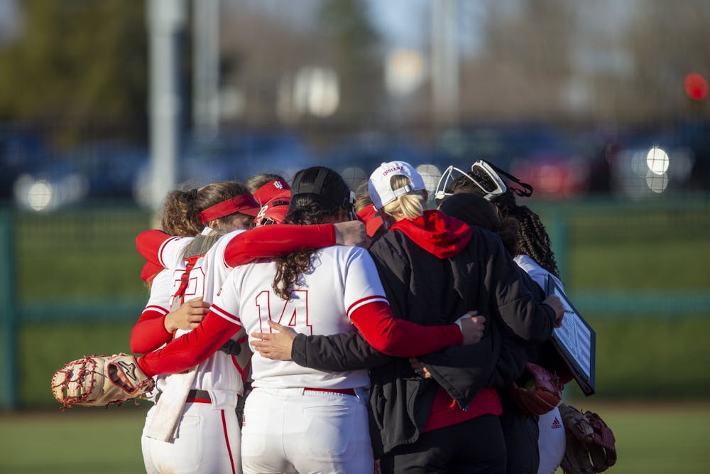 <p>Indiana softball gathers together during a timeout March 28, 2023, at Andy Mohr Field. Indiana&#x27;s game against Ohio State has been postponed due to lightning.</p>