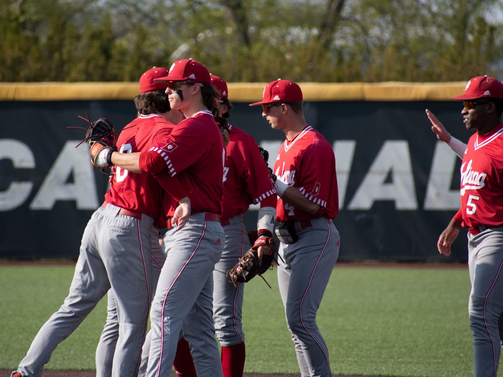 Indiana baseball players celebrate April 25, 2023, after winning 9-8 against Ball State University at First Merchant Ball Park Complex in Muncie, Indiana.