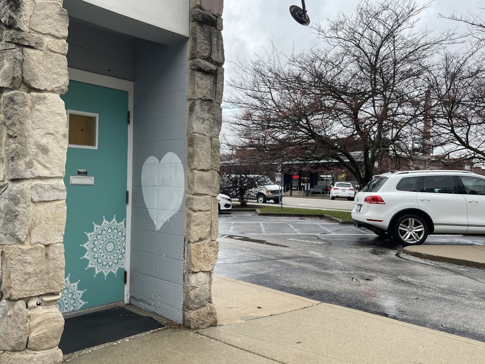 A white heart is seen Dec. 16, 2021, covering a swastika that was found on the side of a building near the corner of Sixth and Madison streets. This was the sixth swastika discovered in Bloomington in the past three weeks.