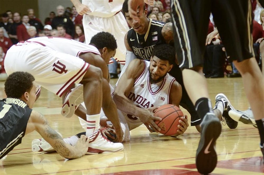 Senior forward Christian Watford scrambles to hold on to the ball during IU's 83-55 win against Purdue on Saturday at Assembly Hall.