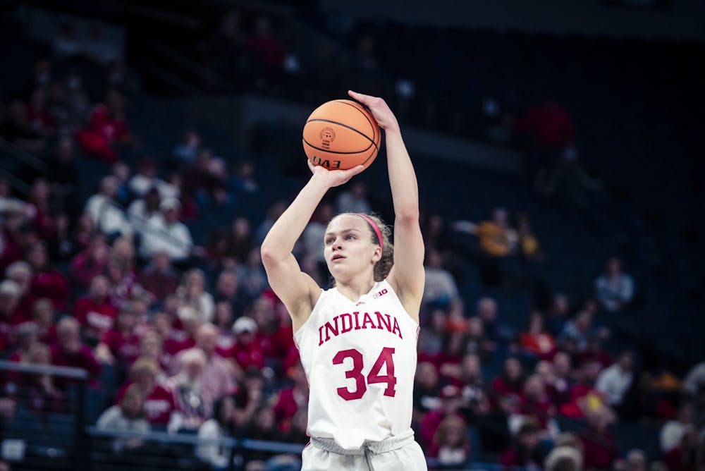 <p>Graduate guard Grace Berger shoots a jumper Mar. 3, 2023, at the Target Center in Minneapolis, Minnesota. Berger was selected 7th overall by the Indiana Fever in the 2023 WNBA Draft Monday night.</p>