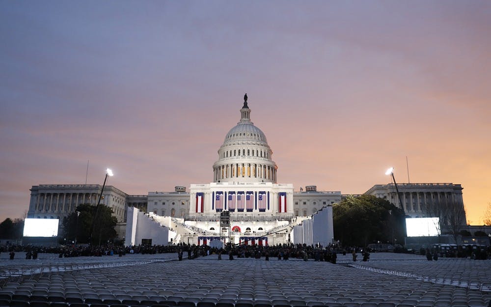 <p>The sun rises over the United States Capitol Building.</p>
